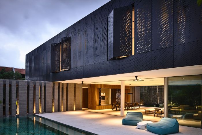 Flat Roof House with perforated Facade
