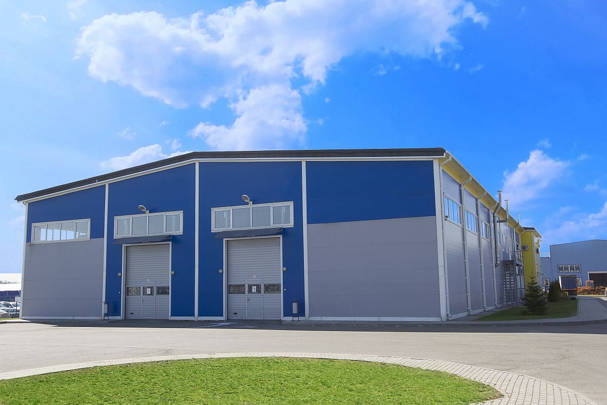 Industrial building against the blue sky. Factory