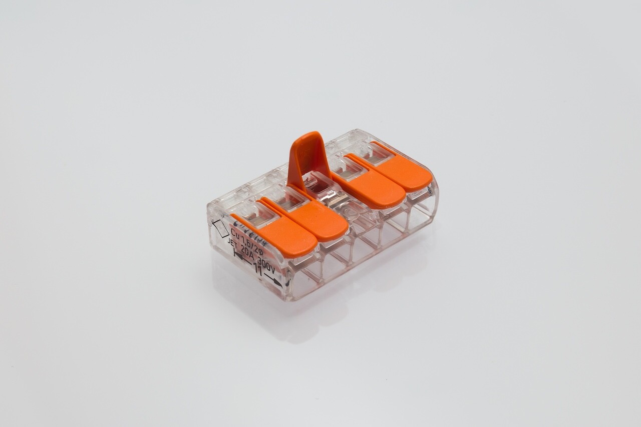 Compact splicing connector isolated on white background.